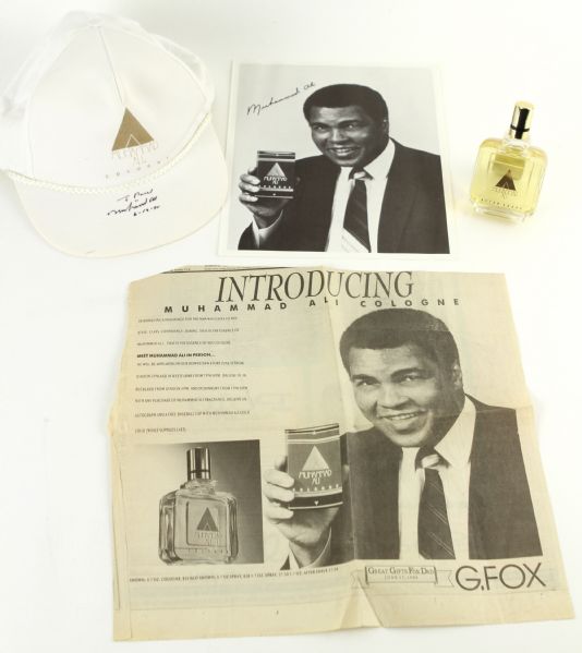 1990 (June 17) Muhammad Ali Cologne Memorabilia Collection - Lot of 4 w/ Bottle of Aftershave, Signed Cap & More (JSA)