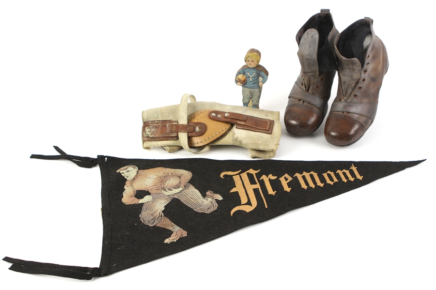 1910s-20s Football Memorabilia - Lot of 4 w/ Boot Style Youth Football Cleats, Dr. A. Peckham Knee Brace, 23" Fremont Pennant & Yale Enameline Cutout