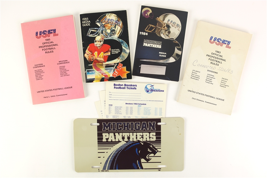 1983-85 USFL Memorabilia Collection - Lot of 8 w/ Media Guides, Rulebooks, License Plate & More