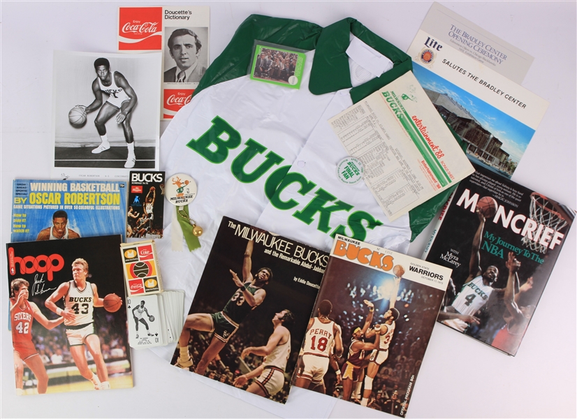 1970s-80s Milwaukee Bucks Memorabilia Collection - Lot of 16 w/ Oscar Robertson Press Photo, Stadium Giveaway Rain Jacket, Sidney Moncrief Signed Book & More (JSA)