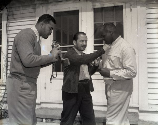1940s circa Joe Louis at his Michigan Cabin "The Chicago Sun-Times" Original 4" x 5" B & W Negatives (Chicago Sun-Times Hologram/MEARS Photo LOA) - Lot of 5