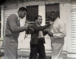 1940s circa Joe Louis at his Michigan Cabin "The Chicago Sun-Times" Original 4" x 5" B & W Negatives (Chicago Sun-Times Hologram/MEARS Photo LOA) - Lot of 5