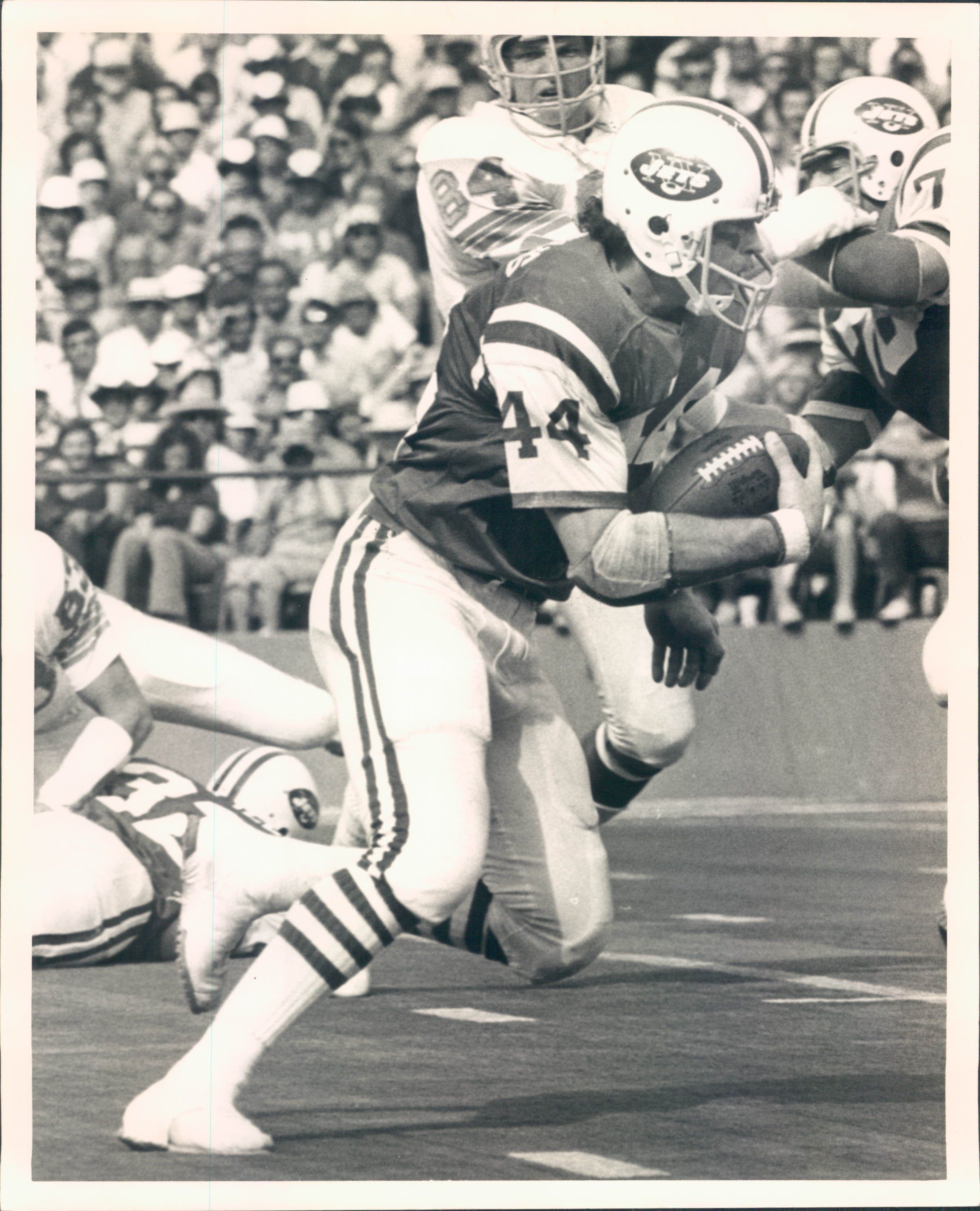 Washington Redskins running back John Riggins (44) looks to happy teammate  Art Monk after running for the Skins third touchdown of their game with the  New York Giants in East Rutherford, N.J.