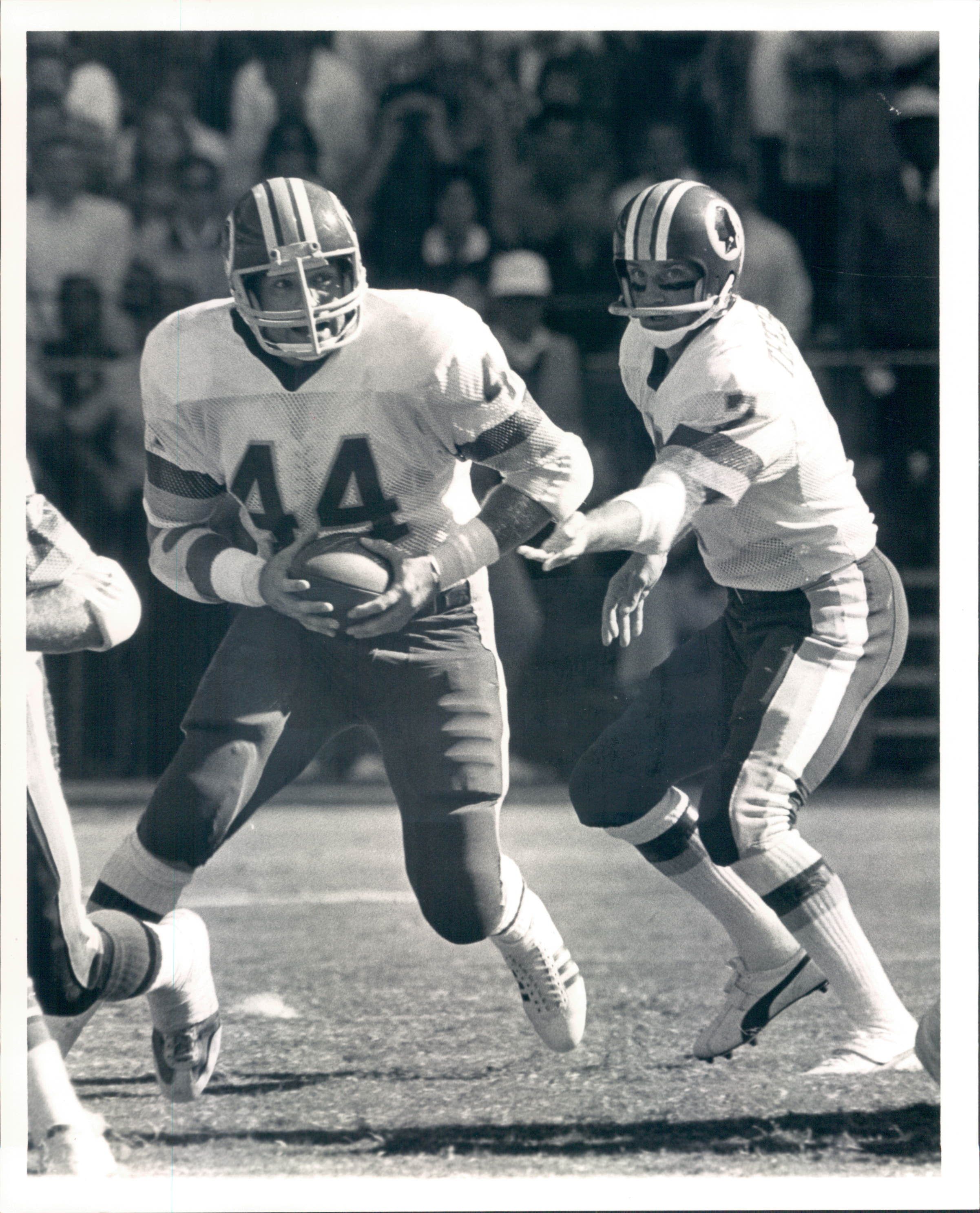 Washington Redskins running back John Riggins (44) looks to happy teammate  Art Monk after running for the Skins third touchdown of their game with the  New York Giants in East Rutherford, N.J.